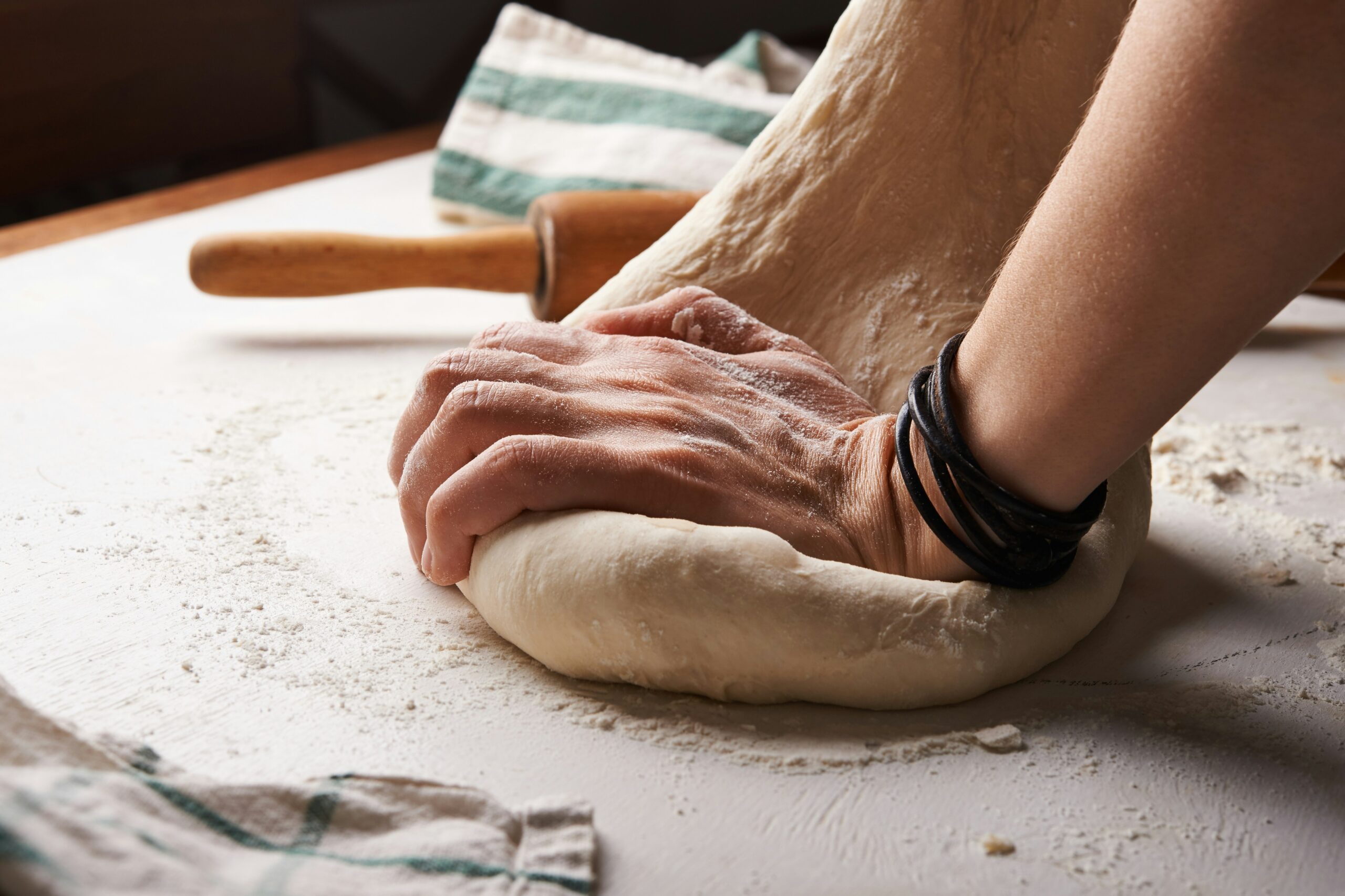Kneading bread, representing a cheap activity to do at the weekend.